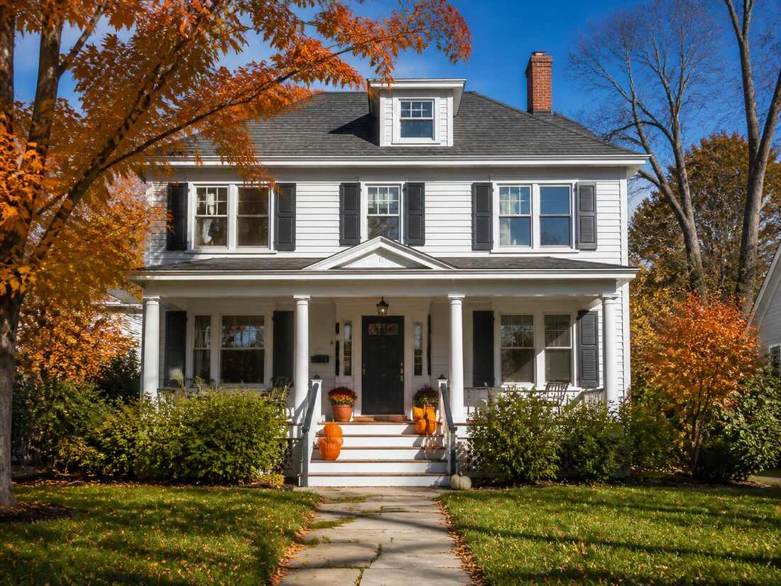 A classic New England home in Arlington, Massachusetts on an autumn day
